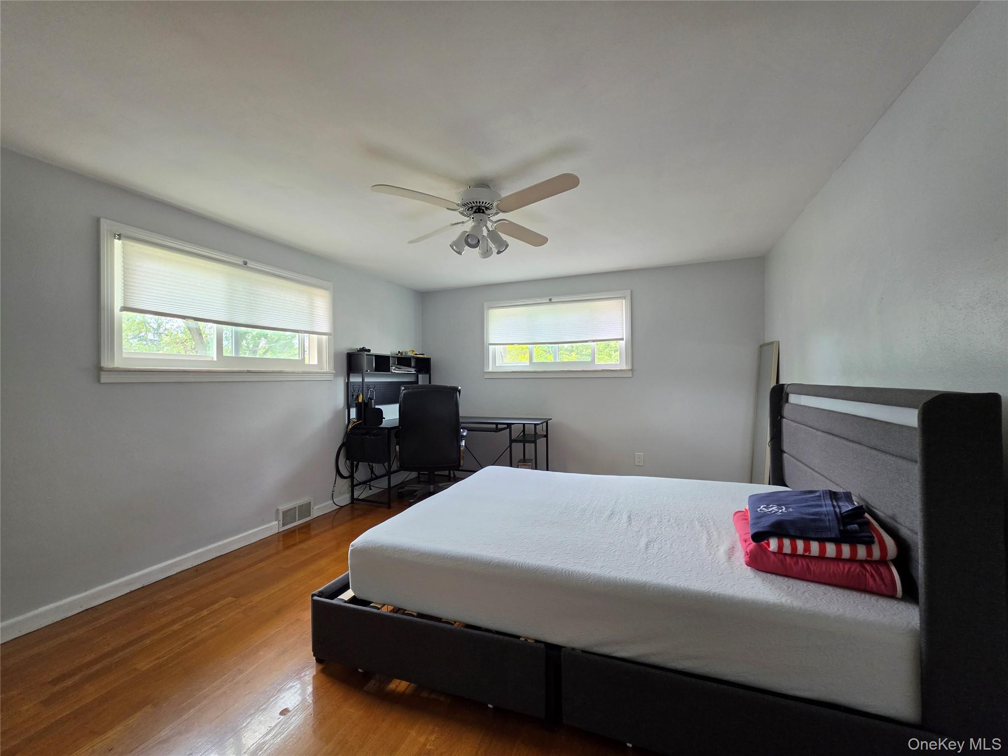 4804 Country Club Road Vestal, NY 13850 - Photo 8 of 15 a bedroom with bed dresser and window