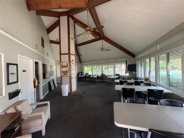 a view of a swimming pool with a yard