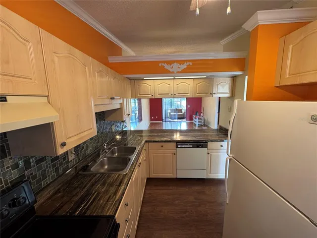 a kitchen with stainless steel appliances a stove and a refrigerator