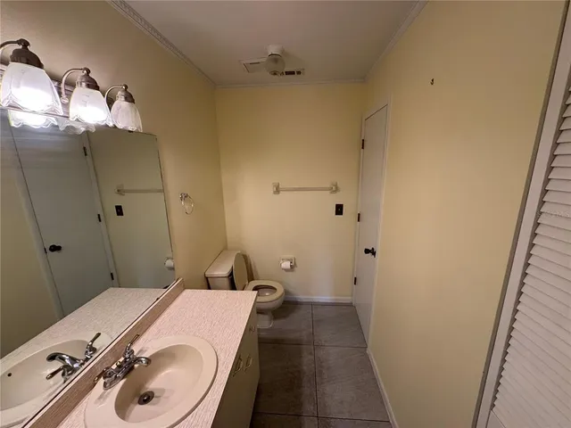 a bathroom with a sink and toilet