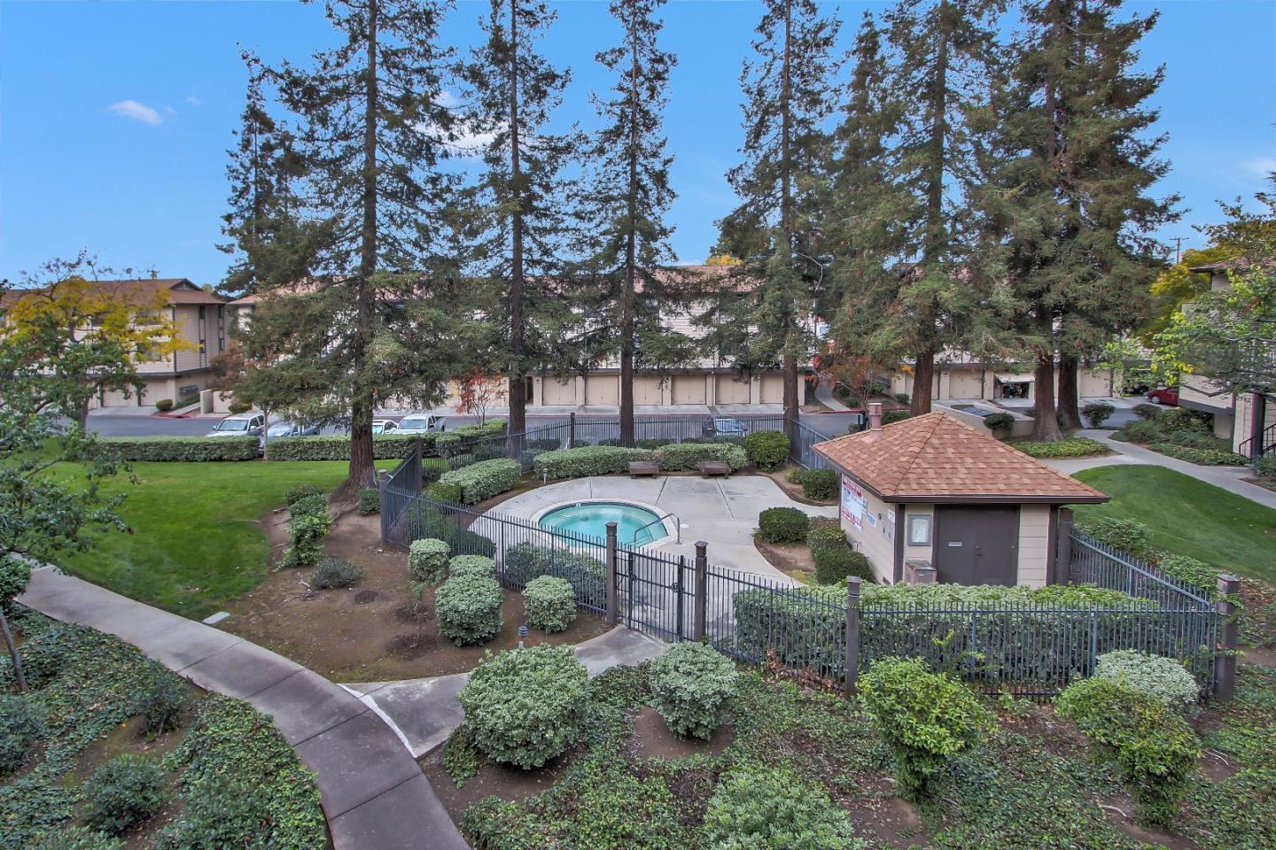 274 Stonegate Circle San Jose, CA 95110 - Photo 19 of 20 a front view of a house with garden and trees