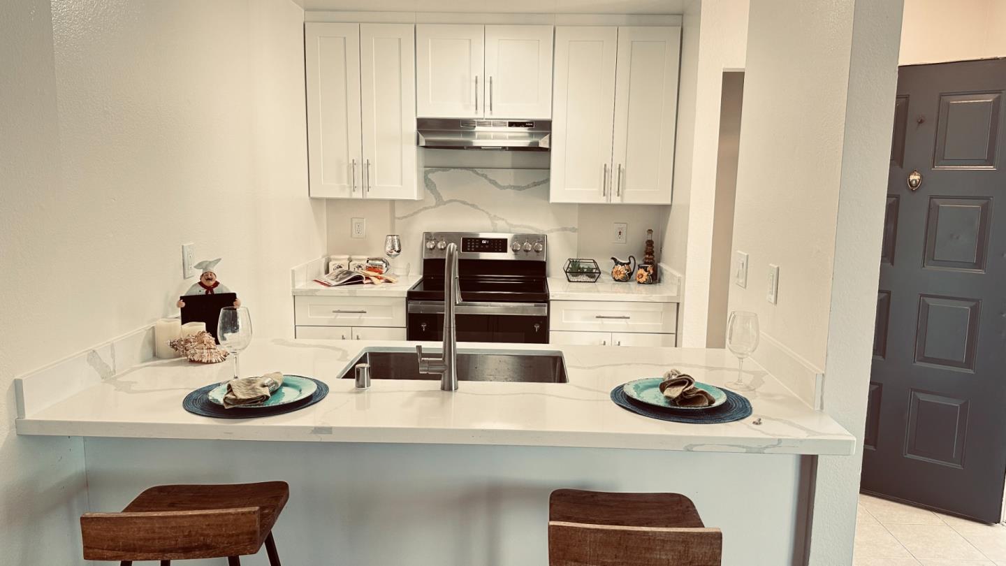 274 Stonegate Circle San Jose, CA 95110 - Photo 4 of 20 a kitchen with a sink a stove and cabinets