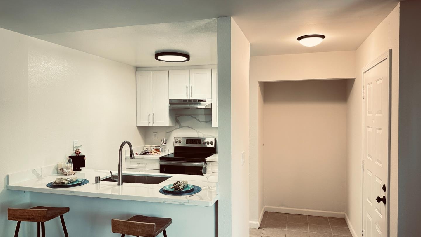 274 Stonegate Circle San Jose, CA 95110 - Photo 5 of 20 a kitchen with a refrigerator and a stove top oven
