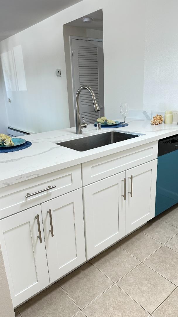 274 Stonegate Circle San Jose, CA 95110 - Photo 7 of 20 a close view of a sink a vanity and dishwasher in a kitchen