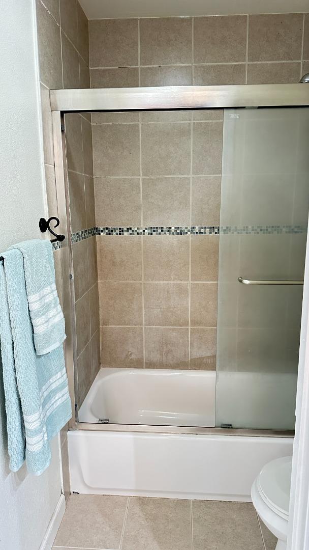274 Stonegate Circle San Jose, CA 95110 - Photo 10 of 20 a bathroom with a bathtub and a shower