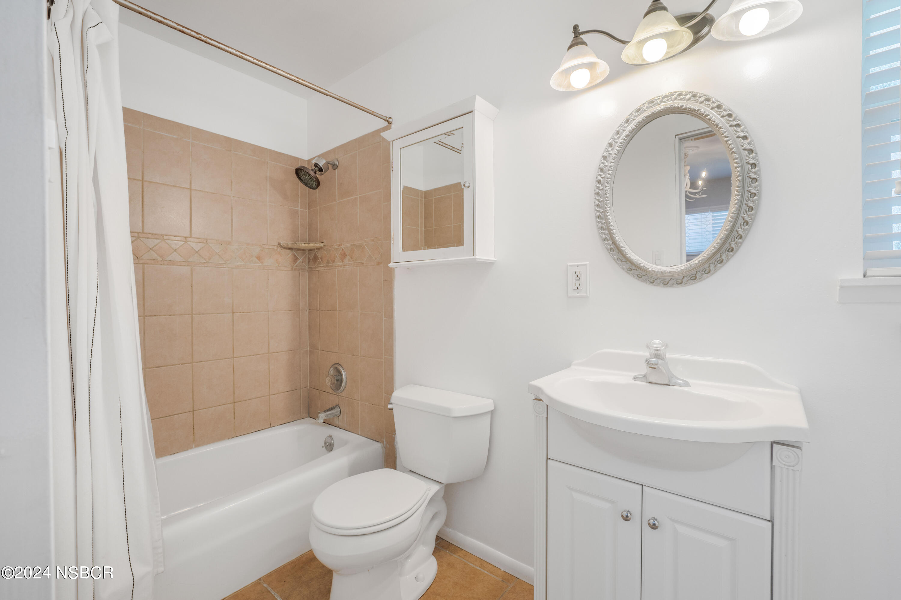 638 Moonglow Road Lompoc, CA 93436 - Photo 14 of 33 a bathroom with a sink toilet and shower