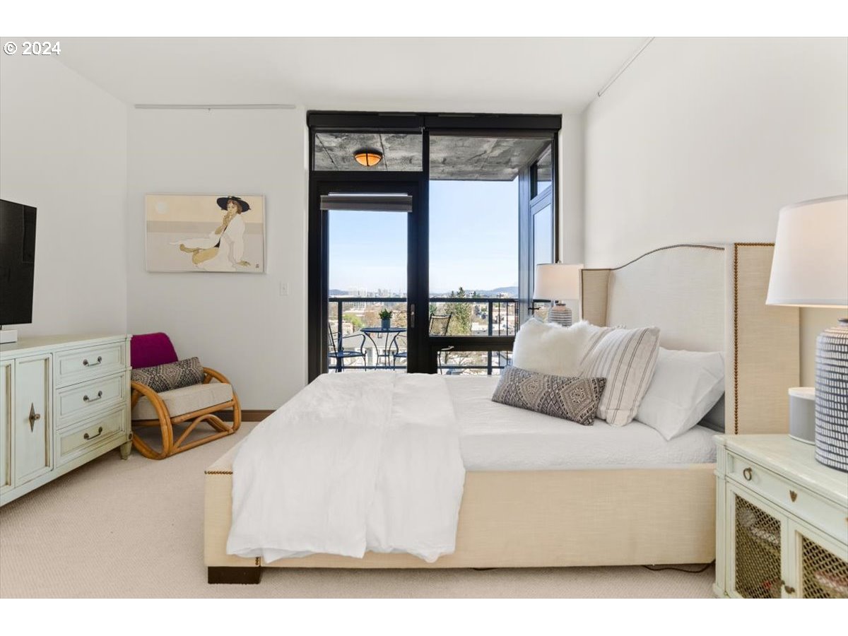 2454 Northwest Westover Road, Unit 5205 Portland, OR 97210 - Photo 17 of 33 a bedroom with a bed and a window