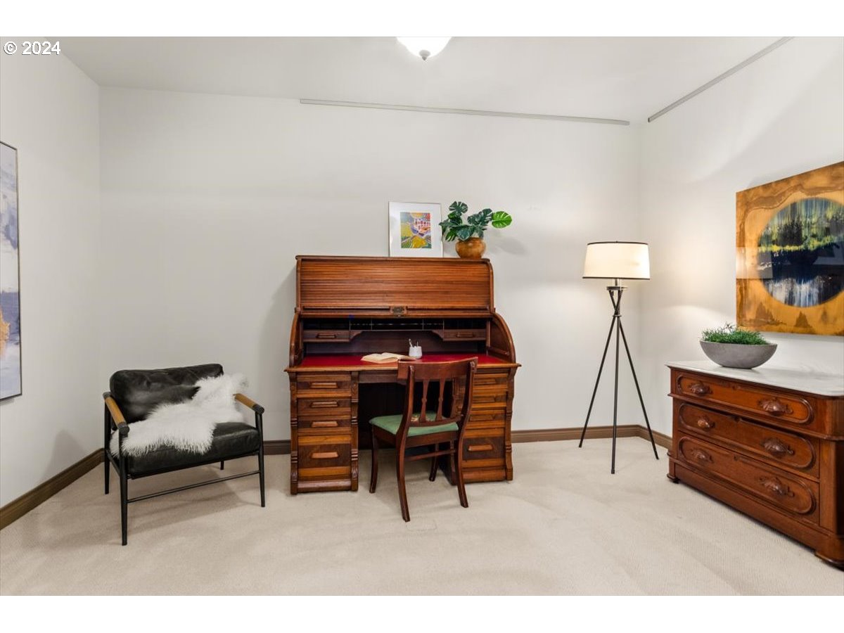 2454 Northwest Westover Road, Unit 5205 Portland, OR 97210 - Photo 23 of 33 a living room with furniture and a flat screen tv