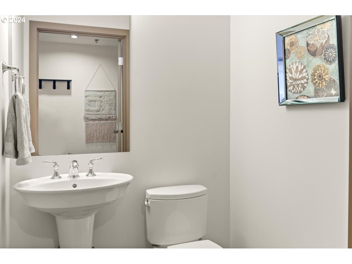 2454 Northwest Westover Road, Unit 5205 Portland, OR 97210 - Photo 24 of 33 a bathroom with a sink and a mirror