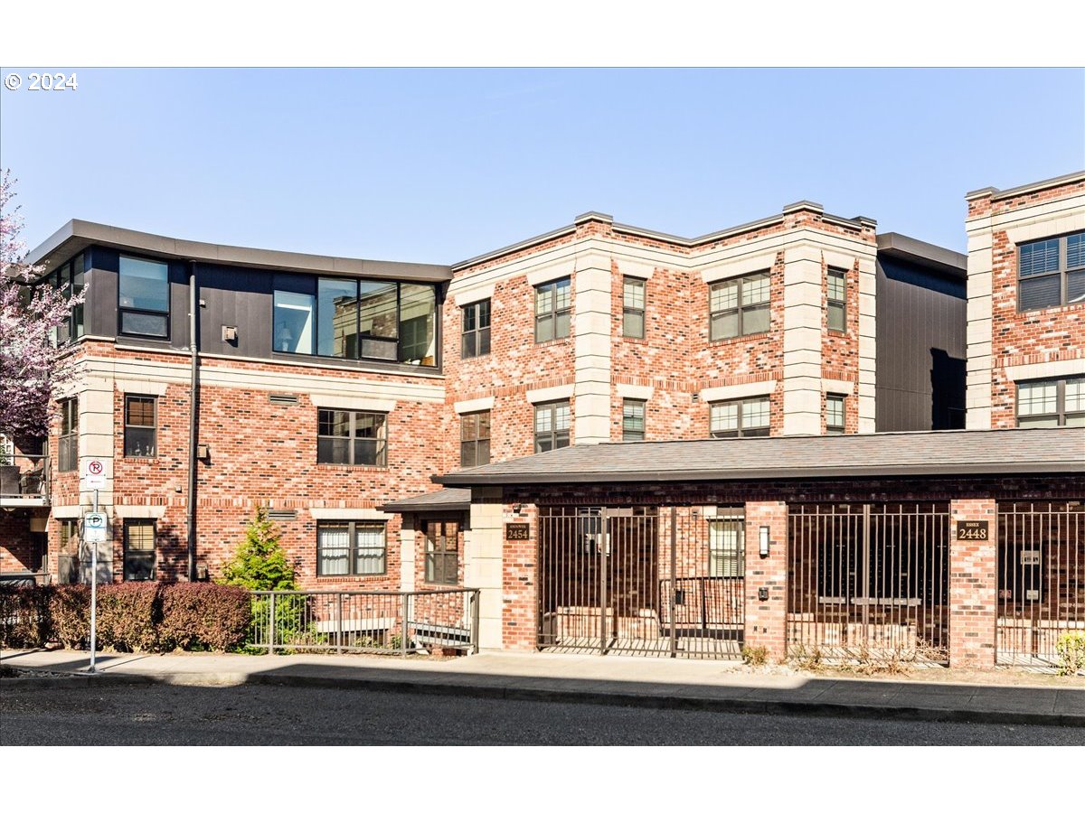 2454 Northwest Westover Road, Unit 5205 Portland, OR 97210 - Photo 33 of 33 a front view of a building with glass windows