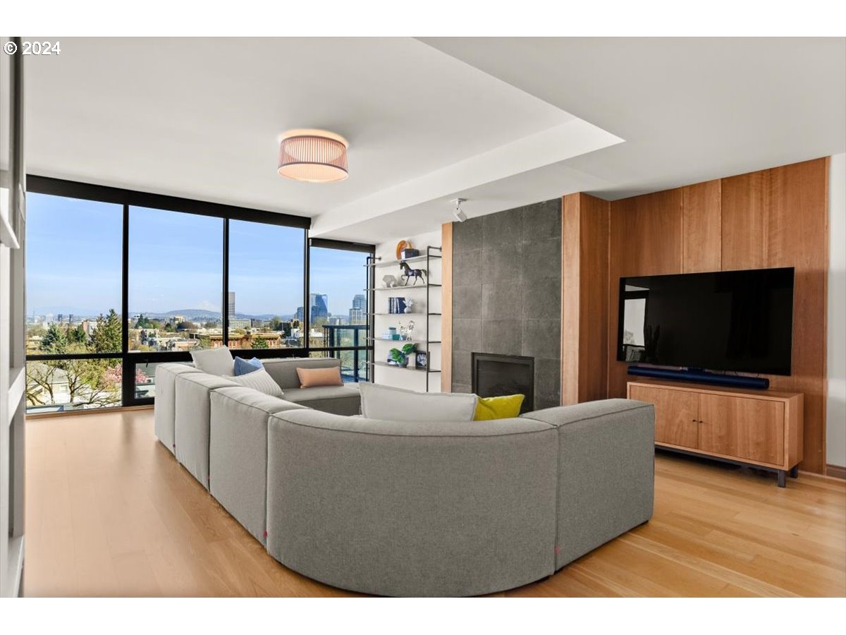 2454 Northwest Westover Road, Unit 5205 Portland, OR 97210 - Photo 5 of 33 a living room with furniture and a flat screen tv