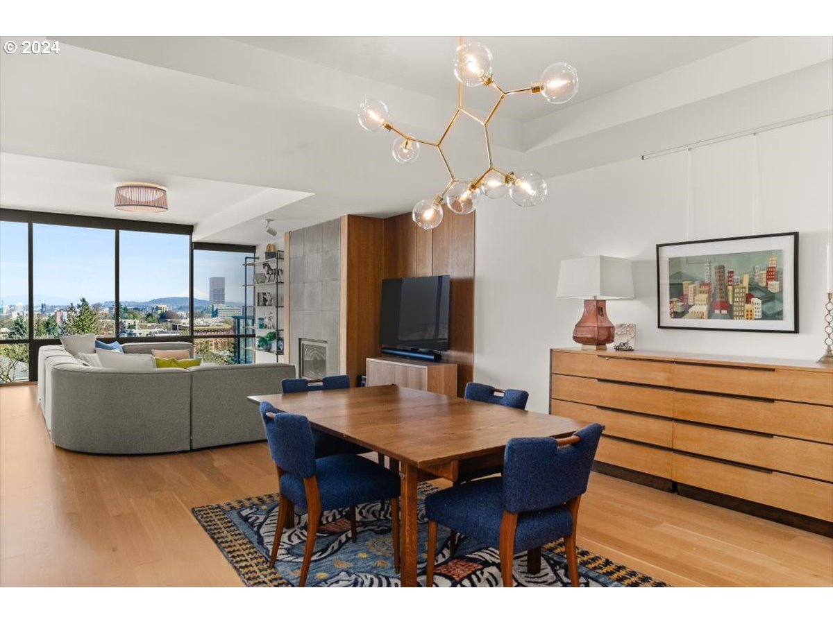 2454 Northwest Westover Road, Unit 5205 Portland, OR 97210 - Photo 9 of 33 a dining room with a large window table and chairs