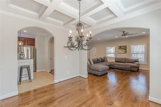 a view of a livingroom with furniture window and wooden floor