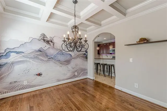 a view of a livingroom with a dishwasher and furniture