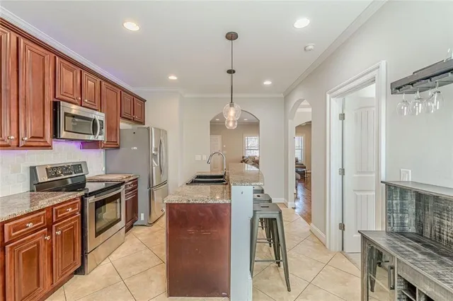 a kitchen with a sink and a stove
