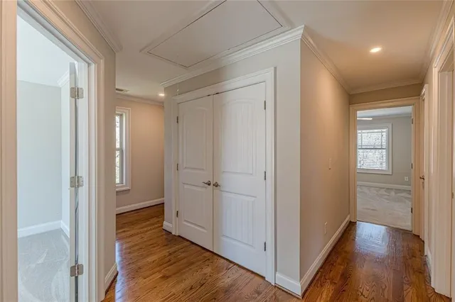 a view of an empty room with a ceiling fan
