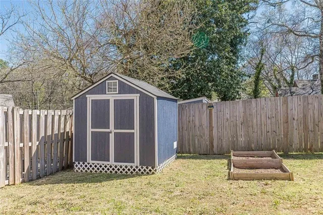a picture of a bench in front of a wall