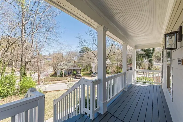 a view of an entryway of a house with wooden floor