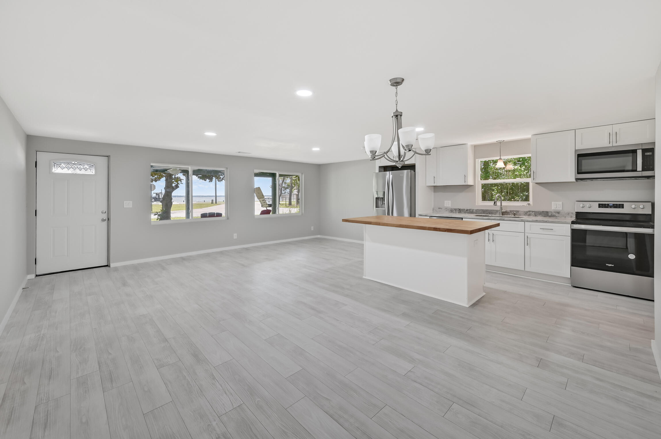 2955 Bay Grove Road Freeport, FL 32439 - Photo 7 of 32 a view of a kitchen with a sink cabinets and wooden floor