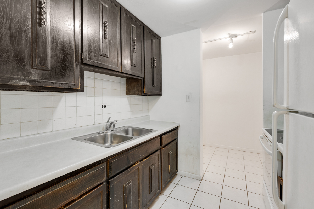 16 East Old Willow Road, Unit 202S Prospect Heights, IL 60070 - Photo 16 of 25 a kitchen with a sink and cabinets