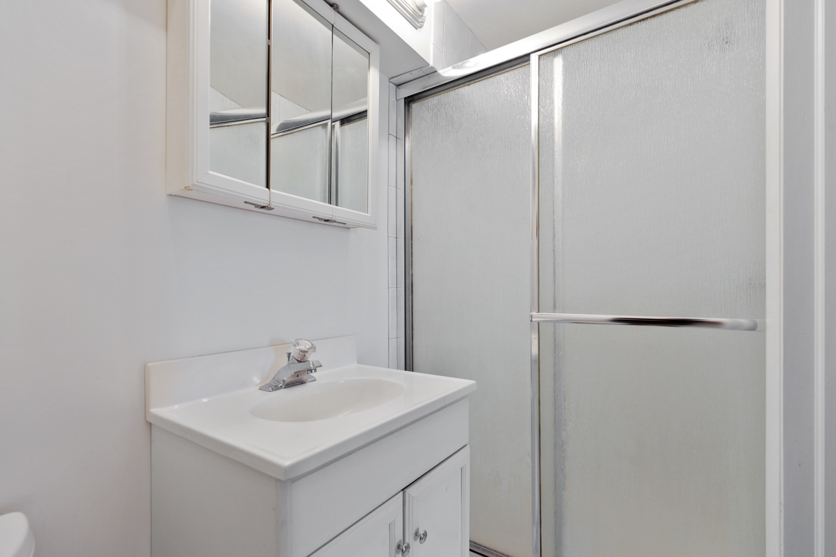 16 East Old Willow Road, Unit 202S Prospect Heights, IL 60070 - Photo 19 of 25 a bathroom with a sink and a mirror