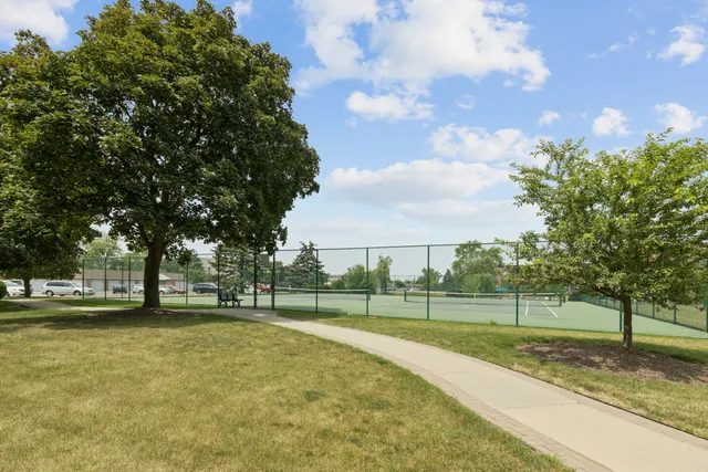 a view of a playground with basketball court