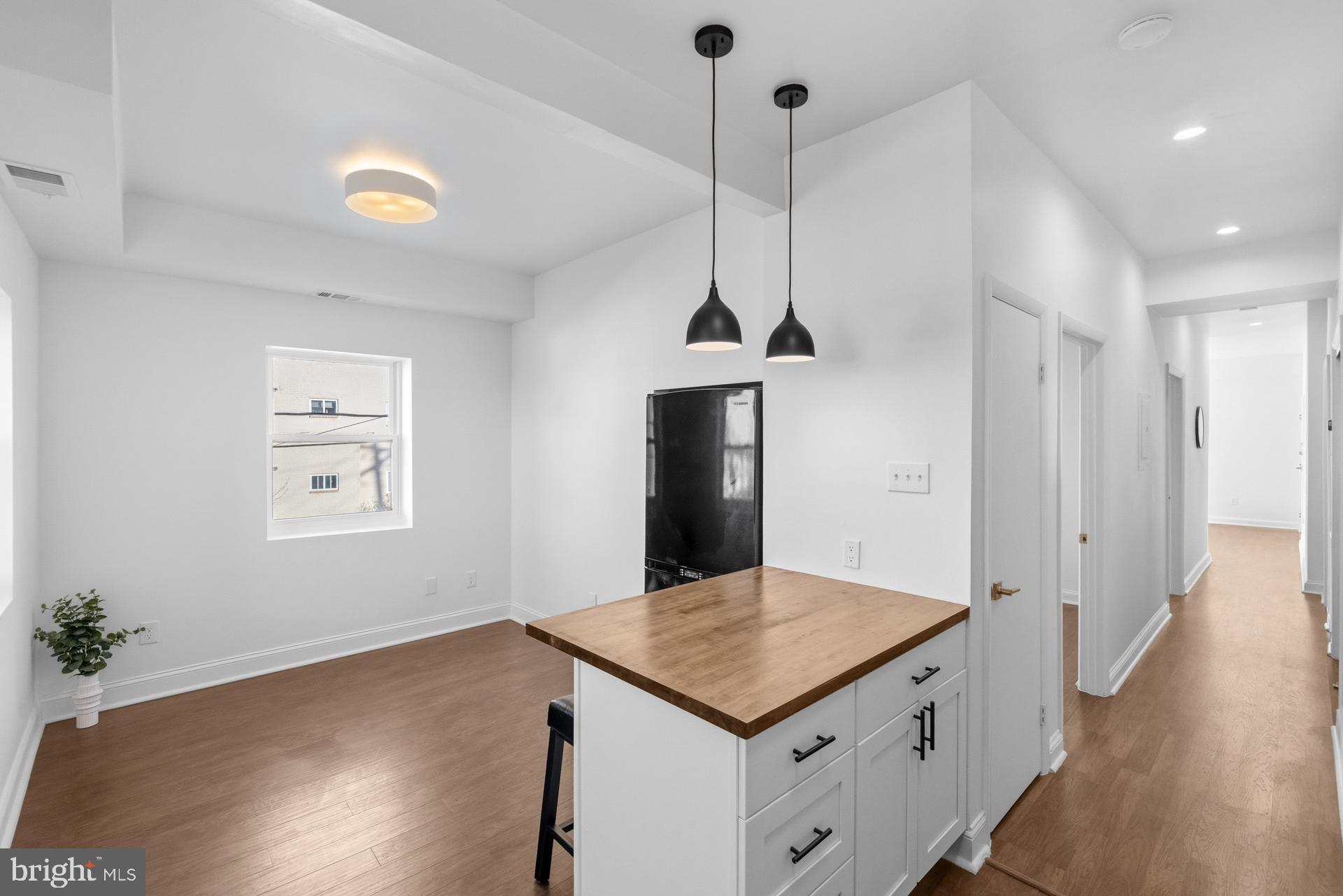 2834 R Street Southeast, Unit 6 Washington, DC 20020 - Photo 28 of 33 a kitchen that has a kitchen island in it