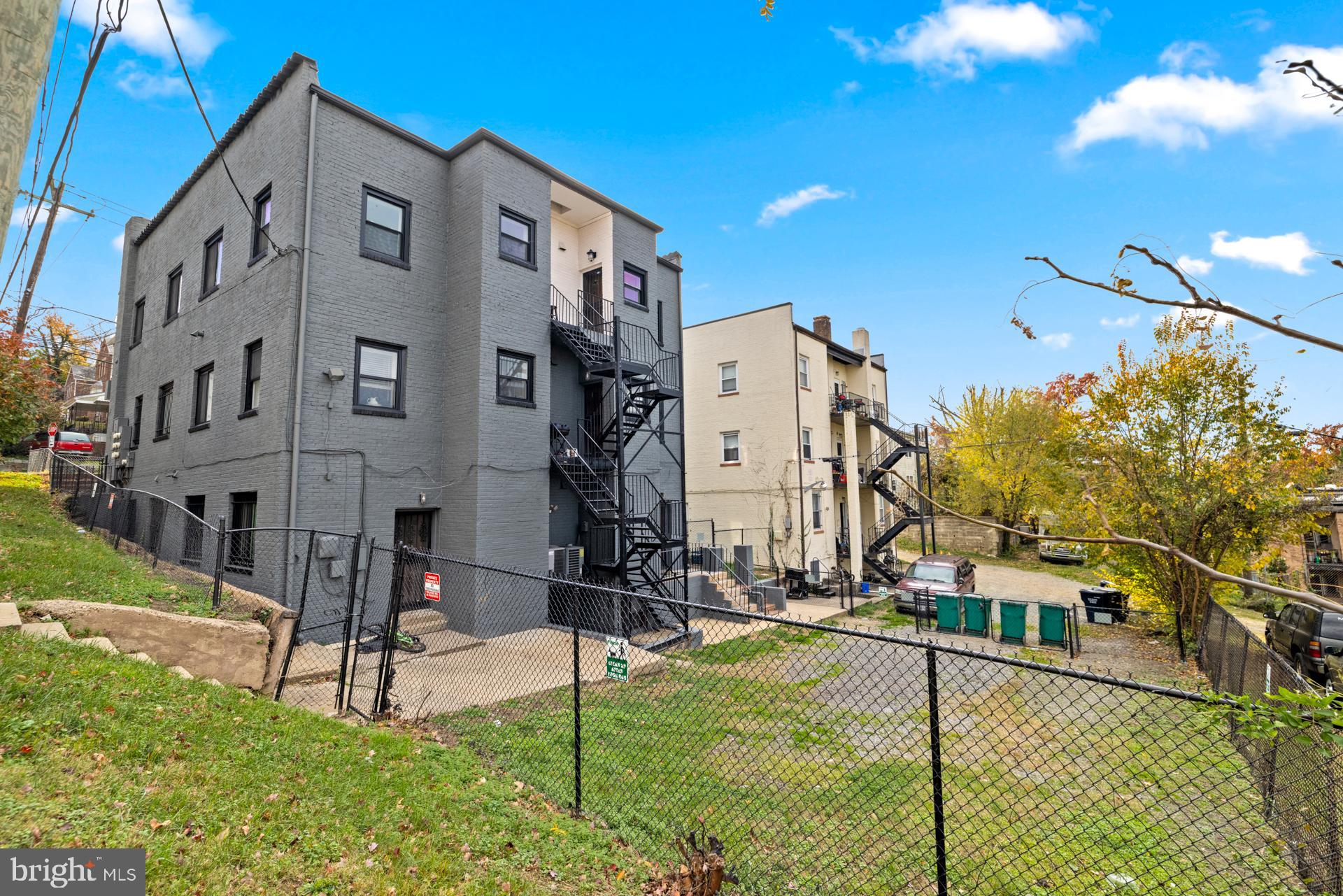 2834 R Street Southeast, Unit 6 Washington, DC 20020 - Photo 3 of 33 a view of a building with a yard