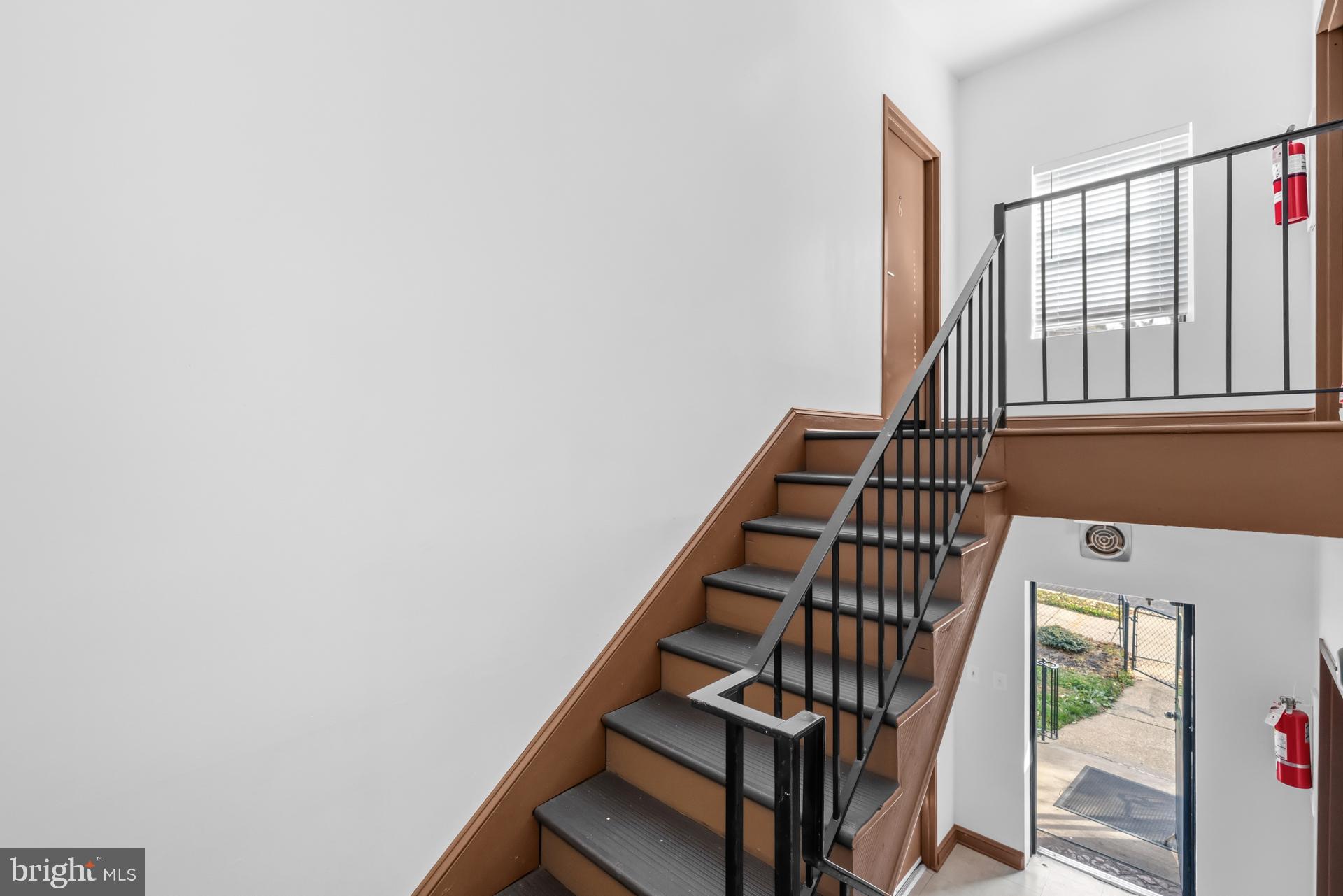 2834 R Street Southeast, Unit 6 Washington, DC 20020 - Photo 5 of 33 a view of staircase with lots of racks on the wall