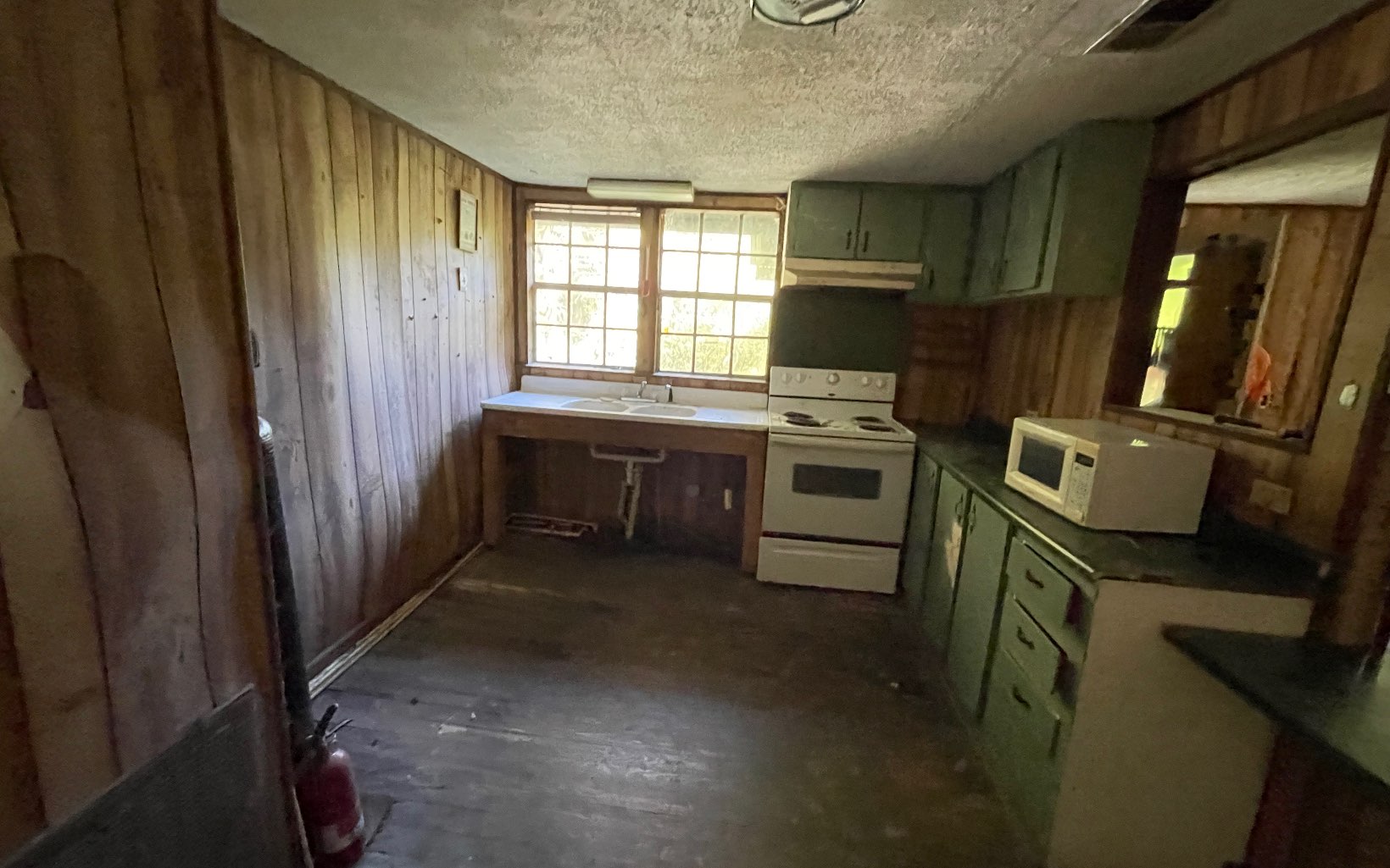 613 Farner Road Farner, TN 37333 - Photo 39 of 45 a kitchen with wooden cabinets and a sink