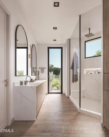 a large white kitchen with a large window