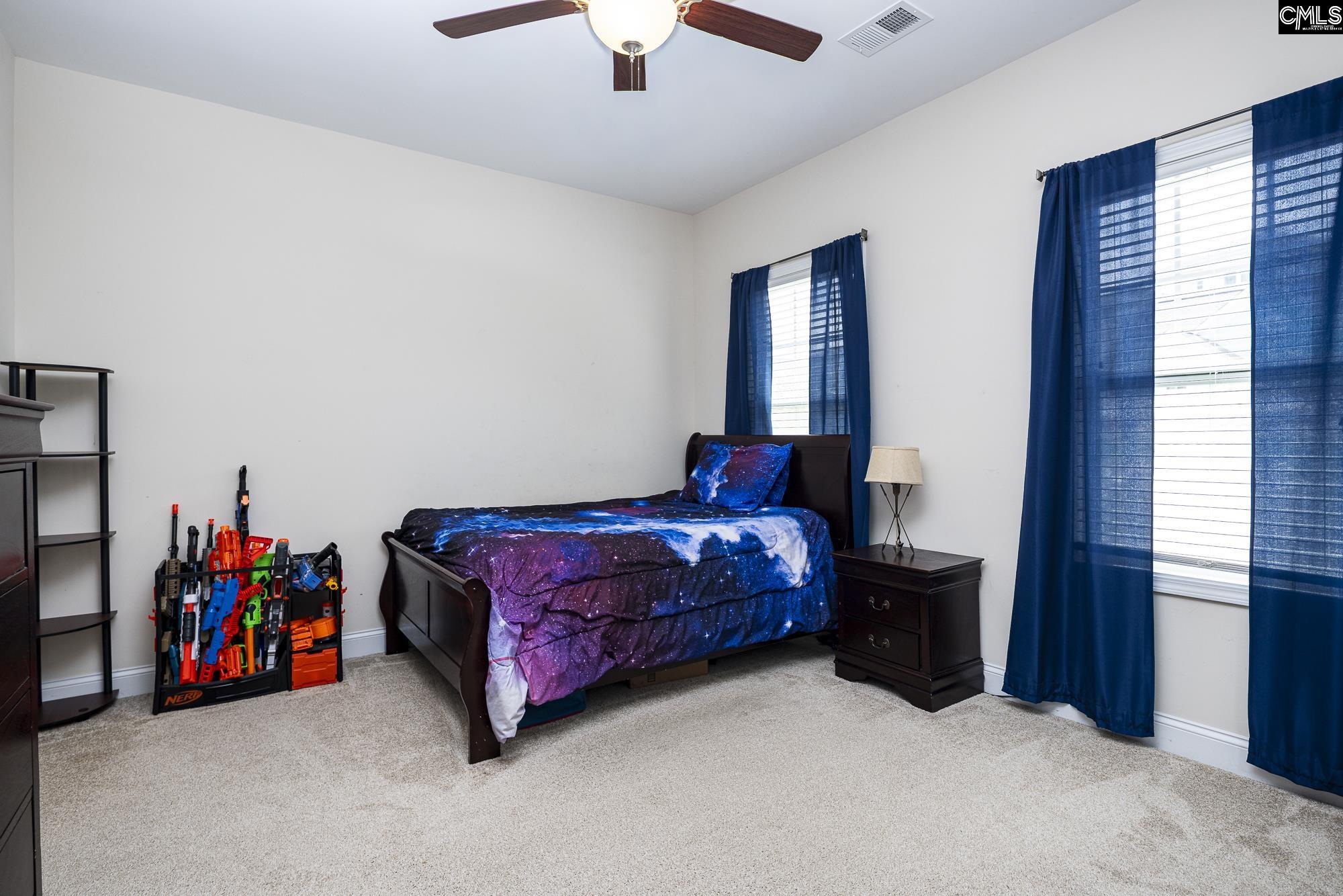 213 Sunset Point Drive Lexington, SC 29072 - Photo 25 of 35 a living room with furniture and a couch