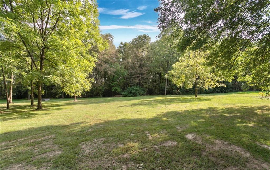465 Edgewood Road Beaver Falls, PA 15010 - Photo 23 of 25 The perimeter of the completely level 2-acre lot is beautifully graced by mature trees...