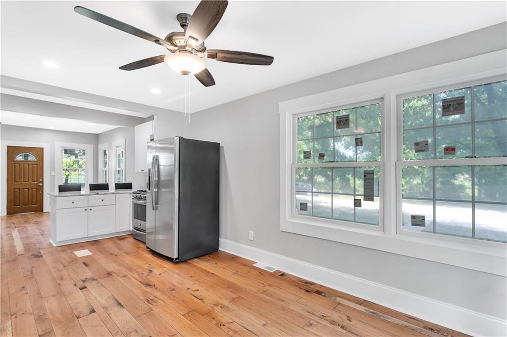 The 9' ceilings sprawl overhead the dining room.