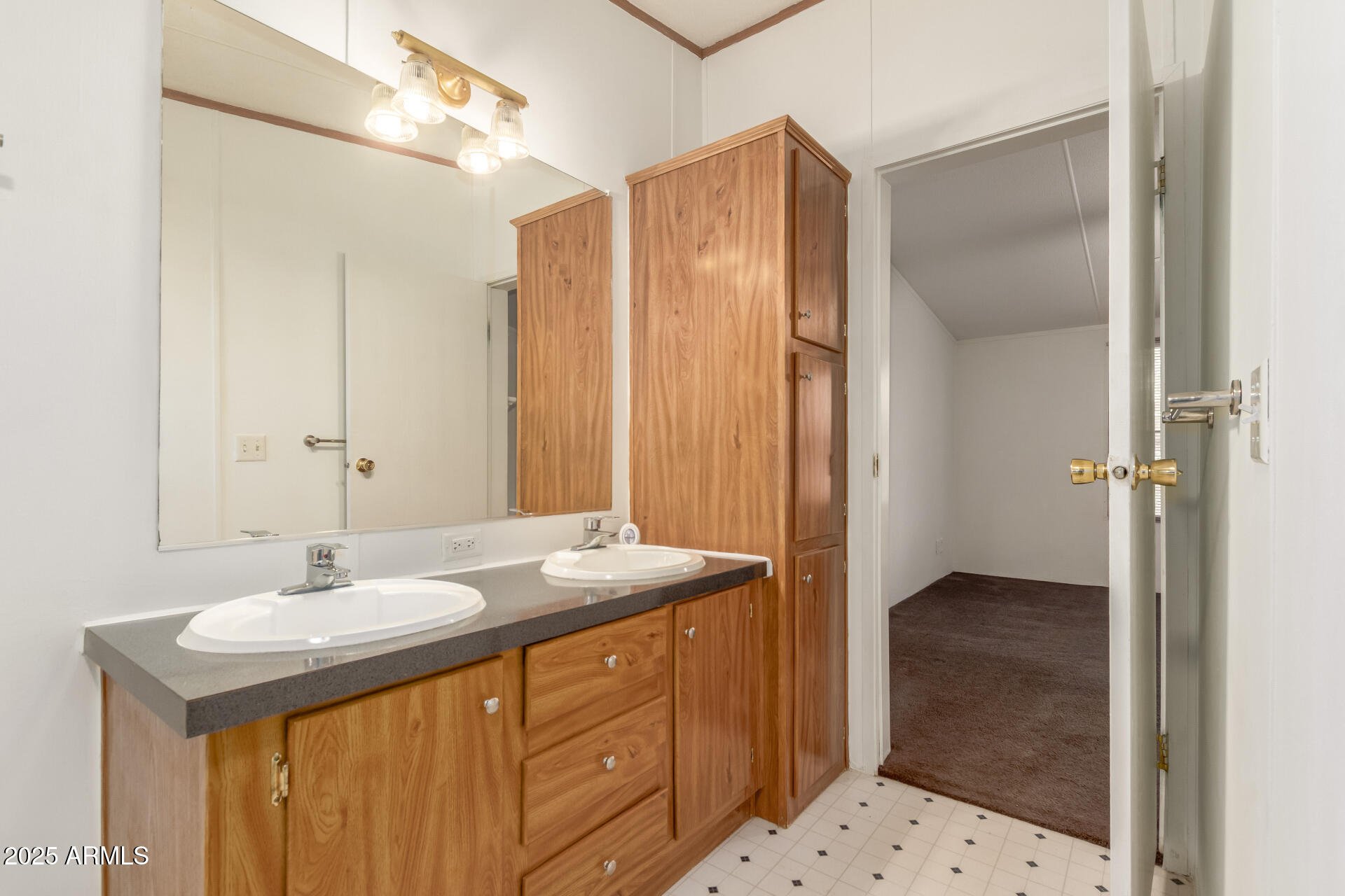 11404 West Custer Road Arizona City, AZ 85123 - Photo 12 of 27 a bathroom with a sink and a mirror