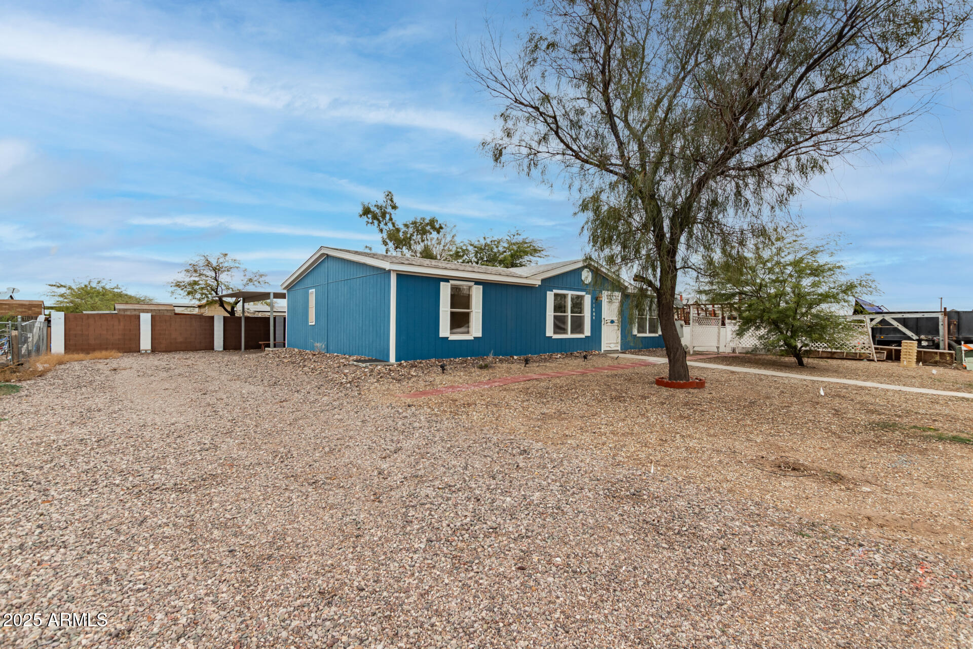 11404 West Custer Road Arizona City, AZ 85123 - Photo 2 of 27 a front view of a house with a yard