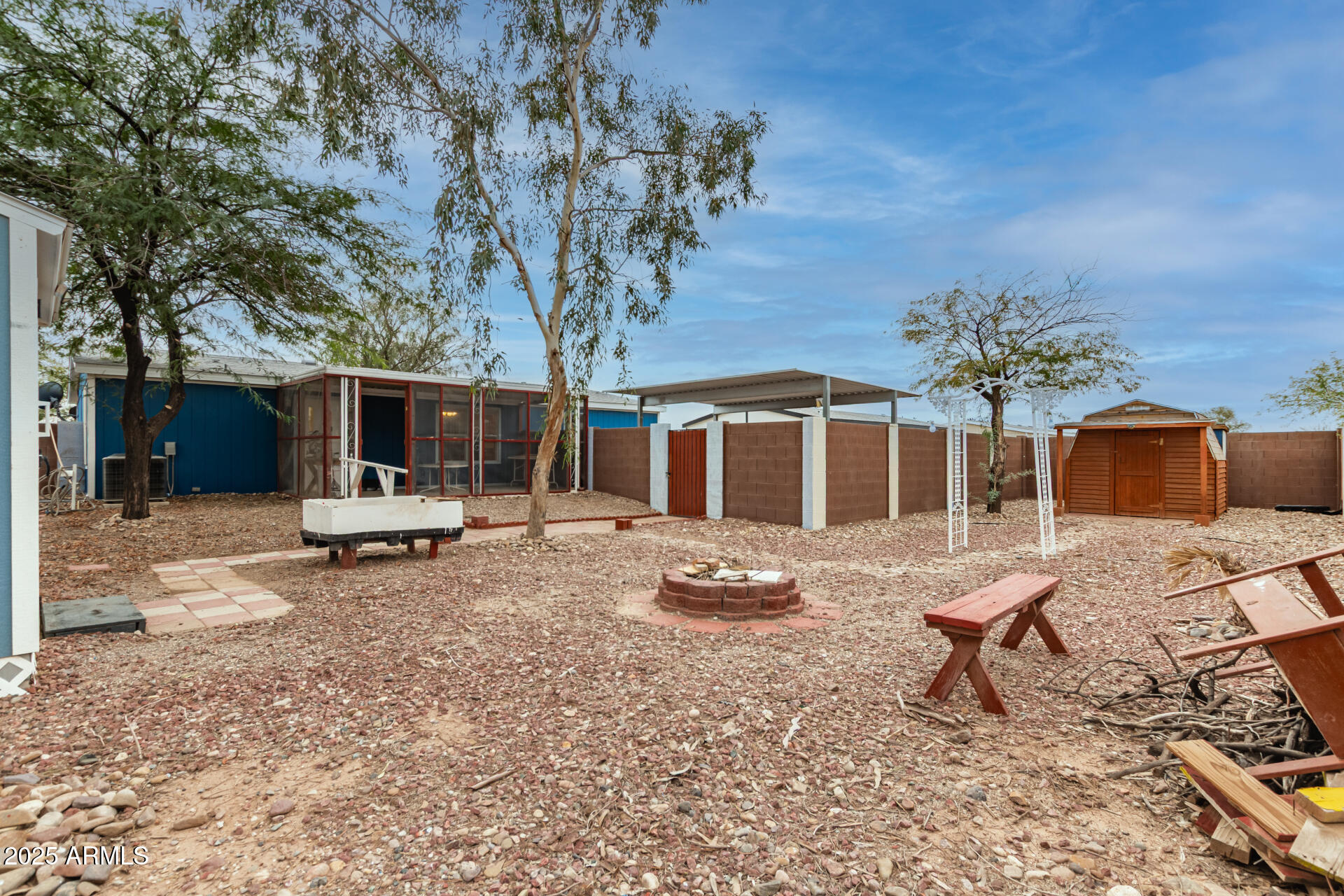 11404 West Custer Road Arizona City, AZ 85123 - Photo 23 of 27 a view of a house with backyard and sitting area