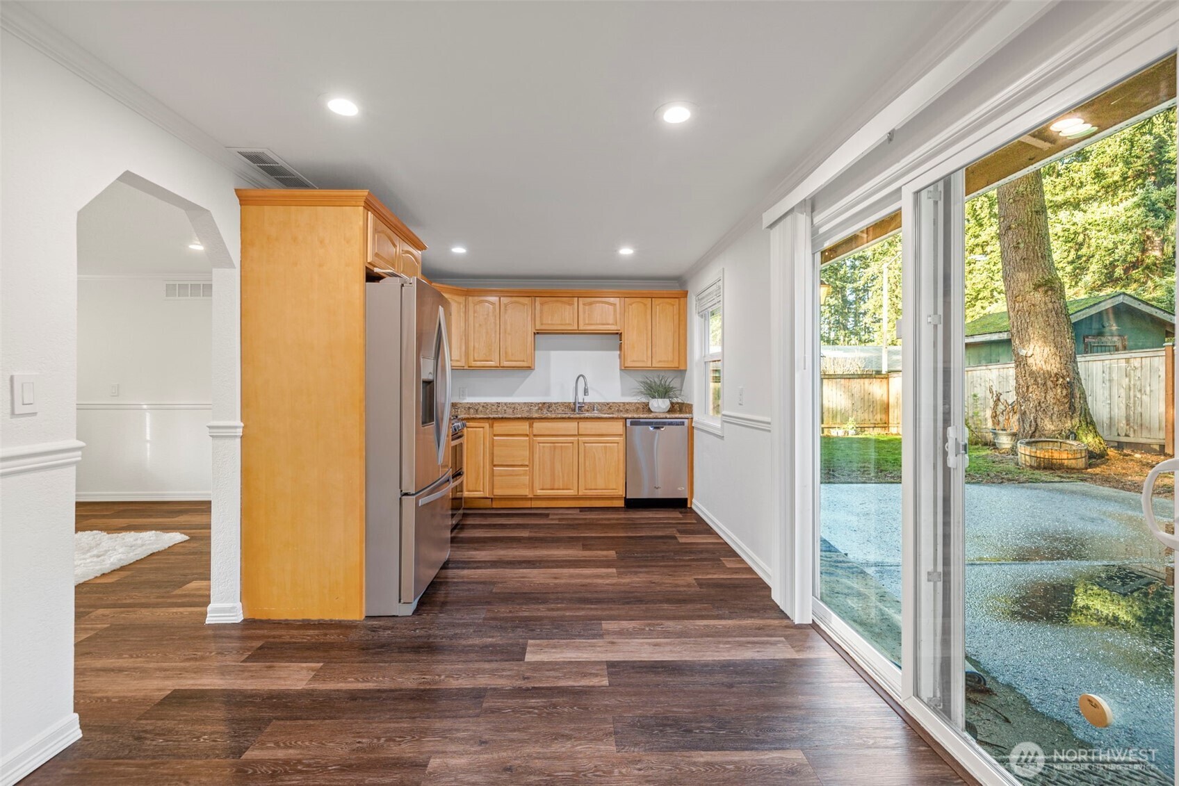 19006 Southeast 269th Street Covington, WA 98042 - Photo 13 of 32 a view of a kitchen with wooden floor and a window