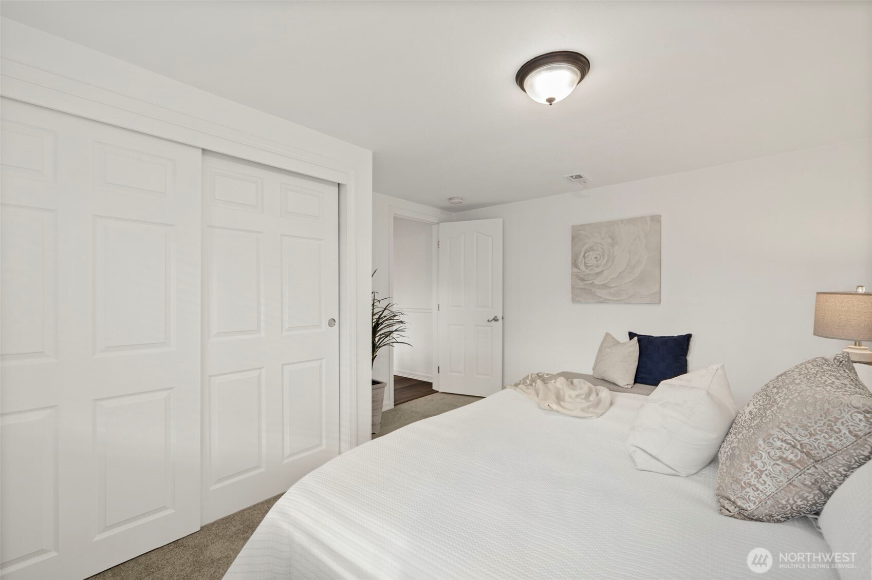 19006 Southeast 269th Street Covington, WA 98042 - Photo 16 of 32 a bedroom with a bed and a night stand