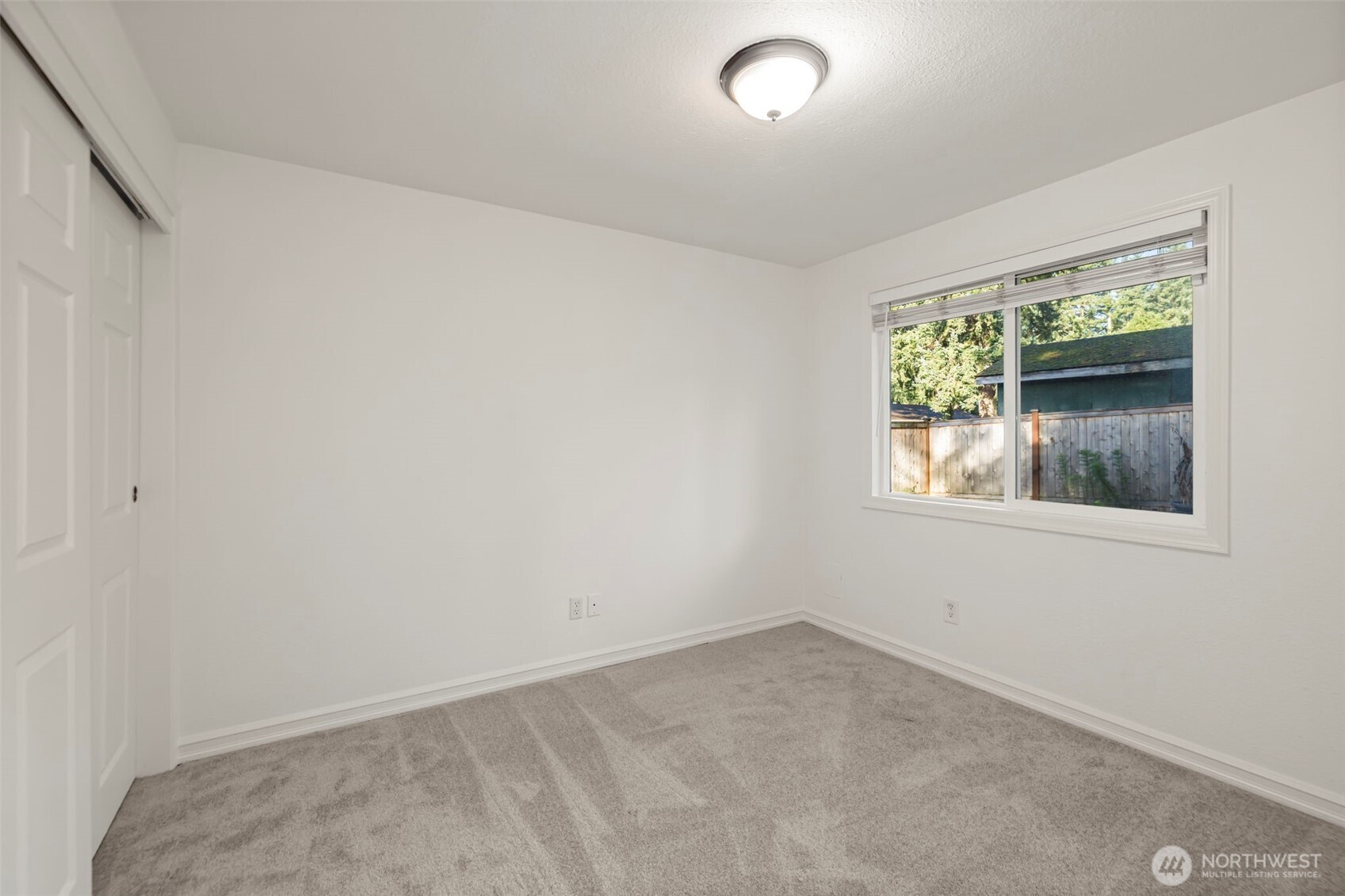 19006 Southeast 269th Street Covington, WA 98042 - Photo 21 of 32 an empty room with a window