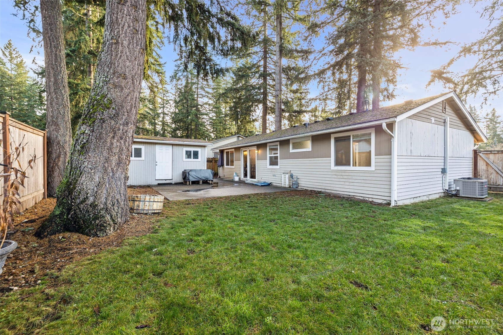 19006 Southeast 269th Street Covington, WA 98042 - Photo 24 of 32 a front view of a house with garden
