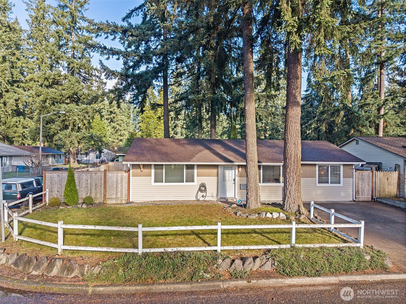 19006 Southeast 269th Street Covington, WA 98042 - Photo 28 of 32 a front view of a house with a yard