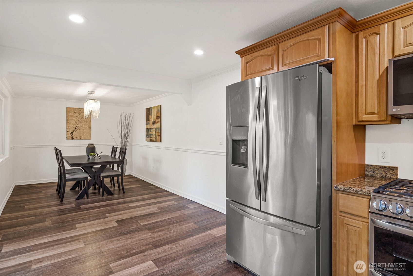 19006 Southeast 269th Street Covington, WA 98042 - Photo 10 of 32 a kitchen with stainless steel appliances granite countertop a refrigerator and a stove top oven