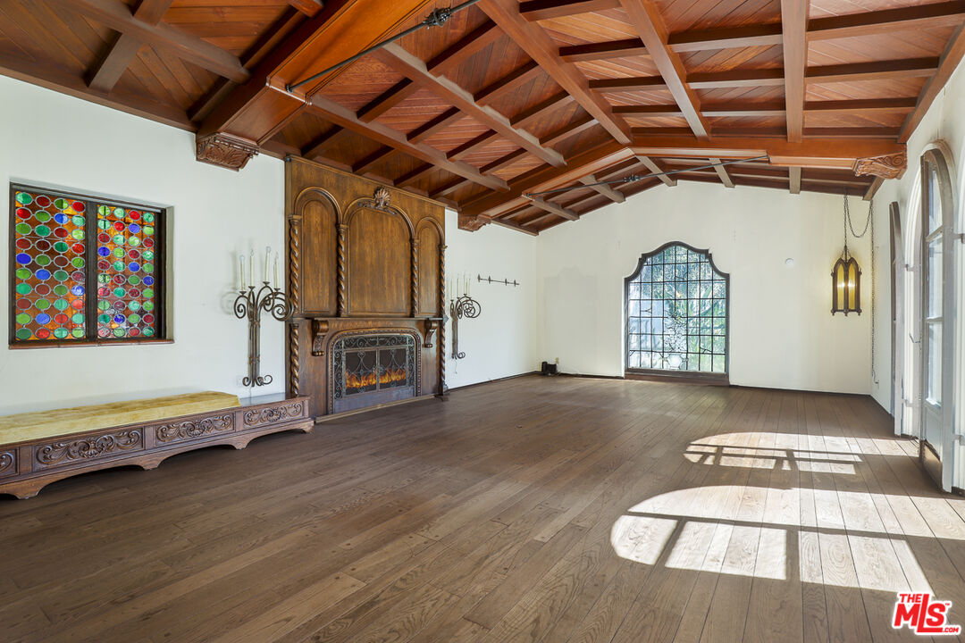 1851 Outpost Drive Los Angeles, CA 90068 - Photo 12 of 24 a view of a room with wooden floors and stairs