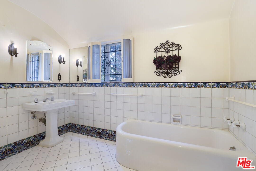 1851 Outpost Drive Los Angeles, CA 90068 - Photo 17 of 24 a bathroom with a bathtub and sink