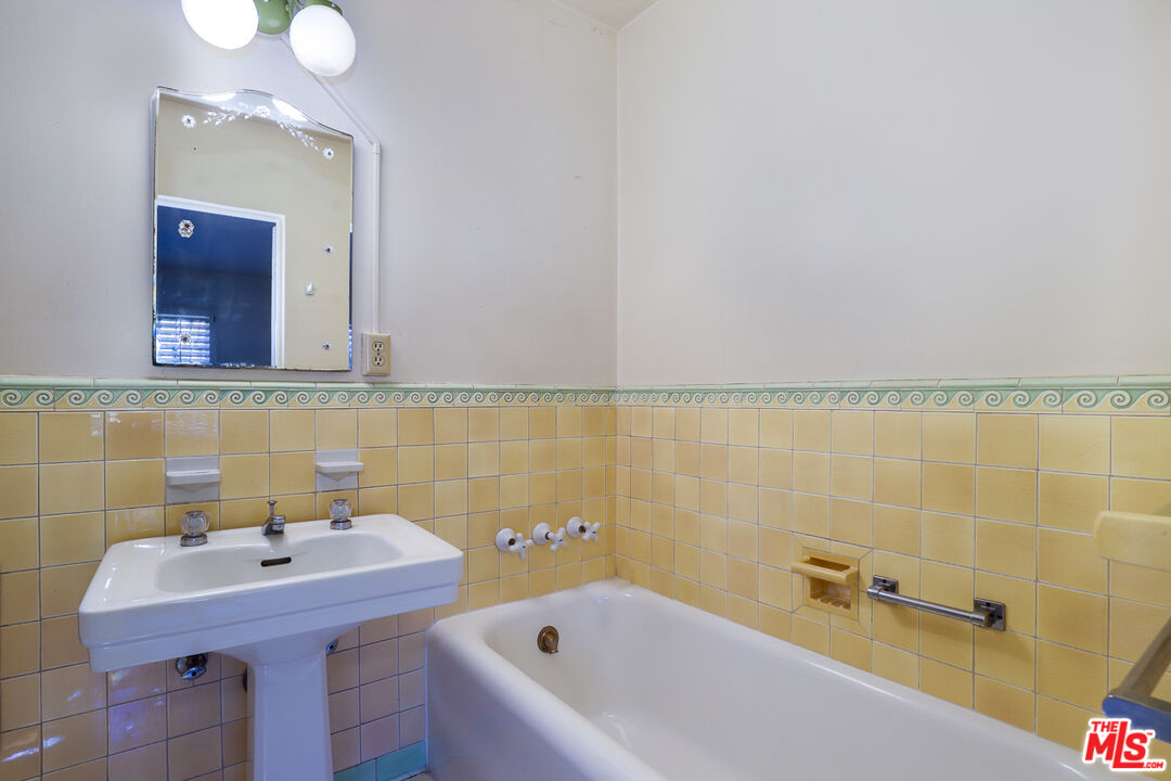 1851 Outpost Drive Los Angeles, CA 90068 - Photo 18 of 24 a bathroom with a sink and a bathtub
