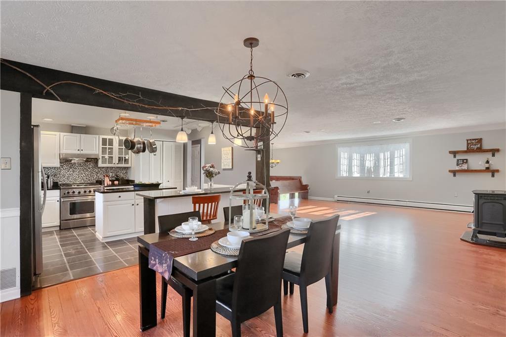 265 Shafer Road Moon Township, PA 15108 - Photo 11 of 50 a view of a dining room with furniture and wooden floor