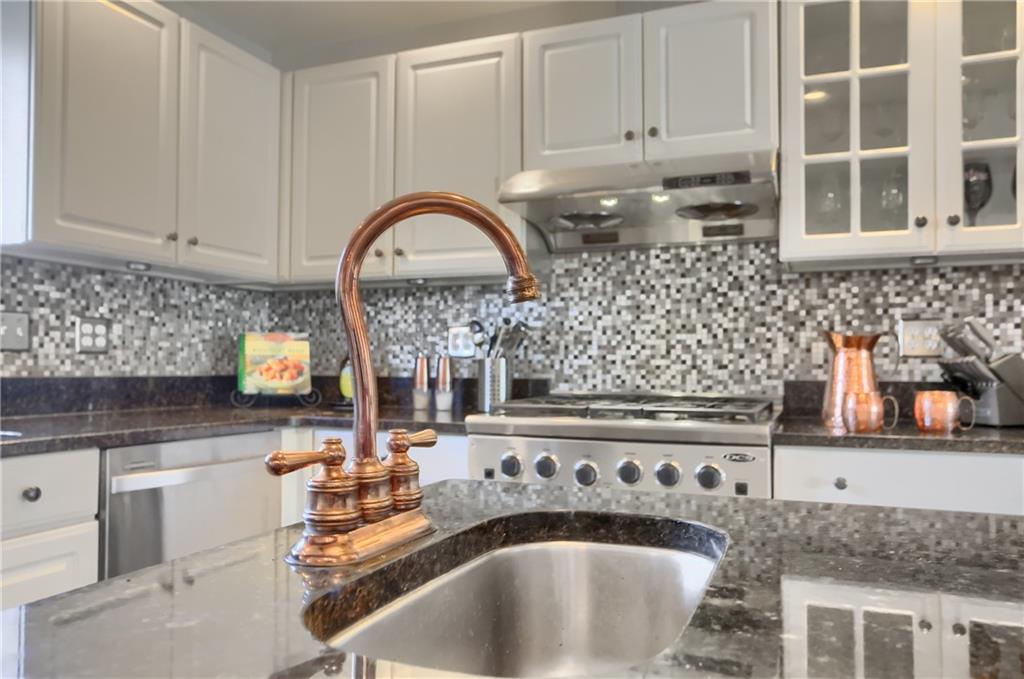 265 Shafer Road Moon Township, PA 15108 - Photo 15 of 50 a kitchen with granite countertop a sink and a stove