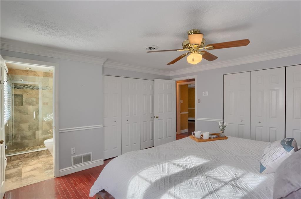 265 Shafer Road Moon Township, PA 15108 - Photo 23 of 50 a bedroom with a bed and a chandelier