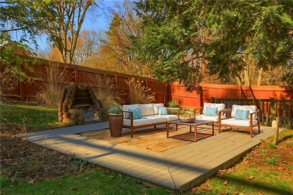 265 Shafer Road Moon Township, PA 15108 - Photo 47 of 50 a view of a patio with couches and table and chairs with wooden fence and floor